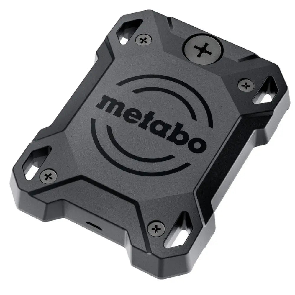 Image of the Metabo Tracker for Apple iPhone iPad for tracking power tools (626965000) a small black rectangular gps tracking tag in black. It has visible screws and screw holes which are one of the methods used to attach it to various items. pictured on a white background.